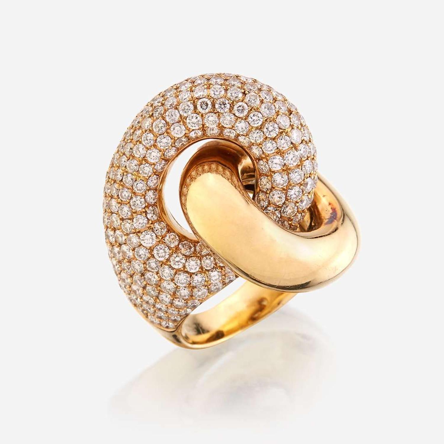 An eighteen karat gold and diamond ring