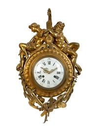 A Louis XVI Style Gilt Bronze Figural Wall Clock — 19TH CENTURY