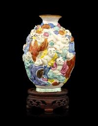 A Chinese Molded Famille Rose Porcelain Snuff Bottle