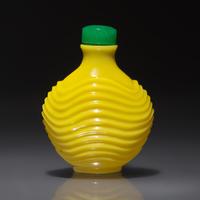 An Imperial Chinese Carved Yellow Glass Snuff Bottle, Qing Dynasty, Circa 1723-1795 — 1723-1795年 御製鷄油黃料雕波紋鼻煙壺