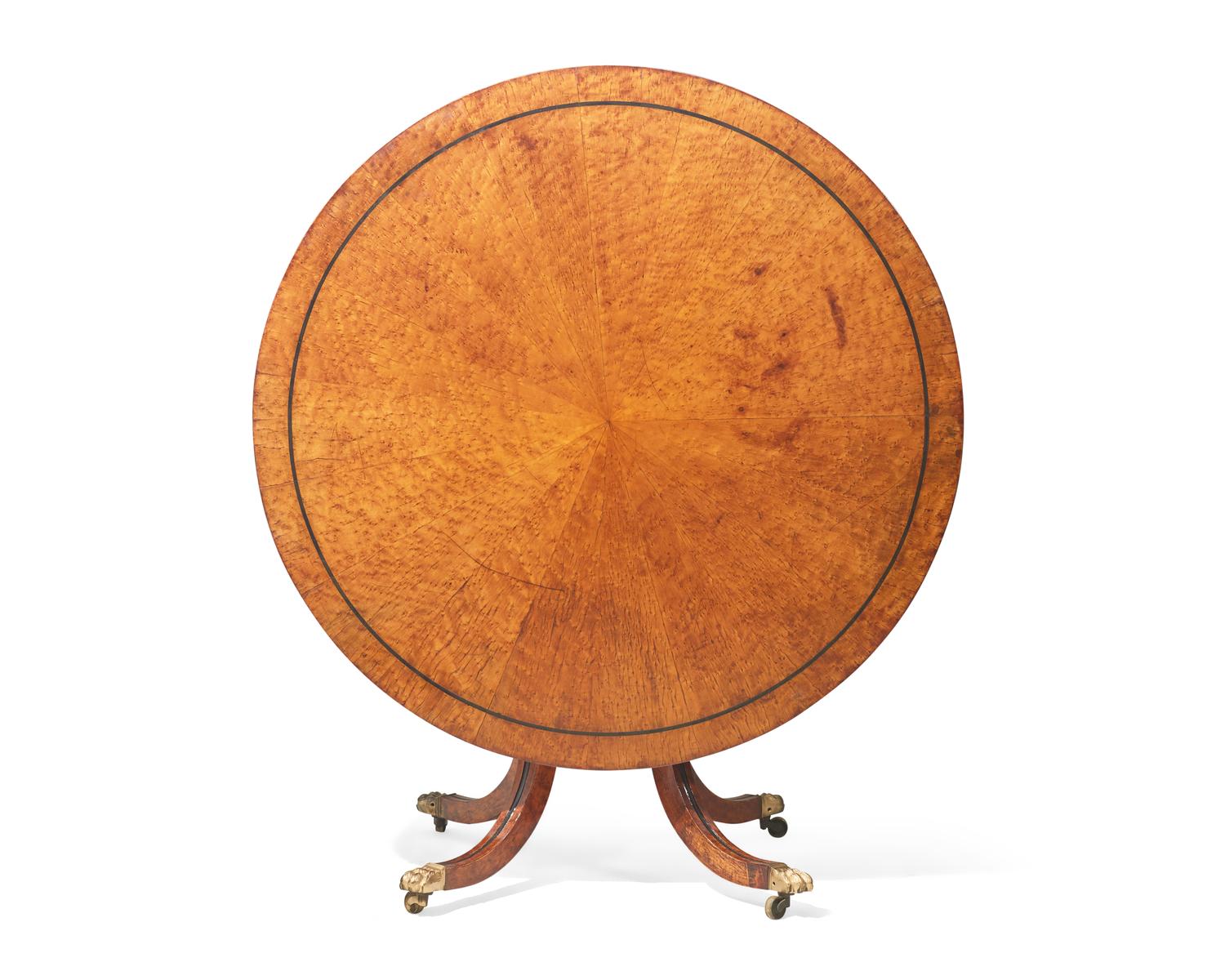 A Regency parcel-ebonized pollard oak breakfast table, circa 1820