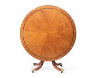 A Regency parcel-ebonized pollard oak breakfast table, circa 1820