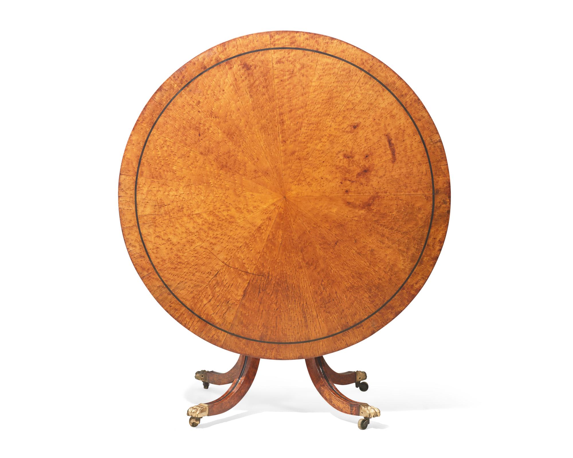 A Regency parcel-ebonized pollard oak breakfast table, circa 1820