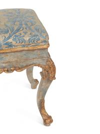 An Italian Painted and Parcel Gilt Bench with Fortuny Upholstery