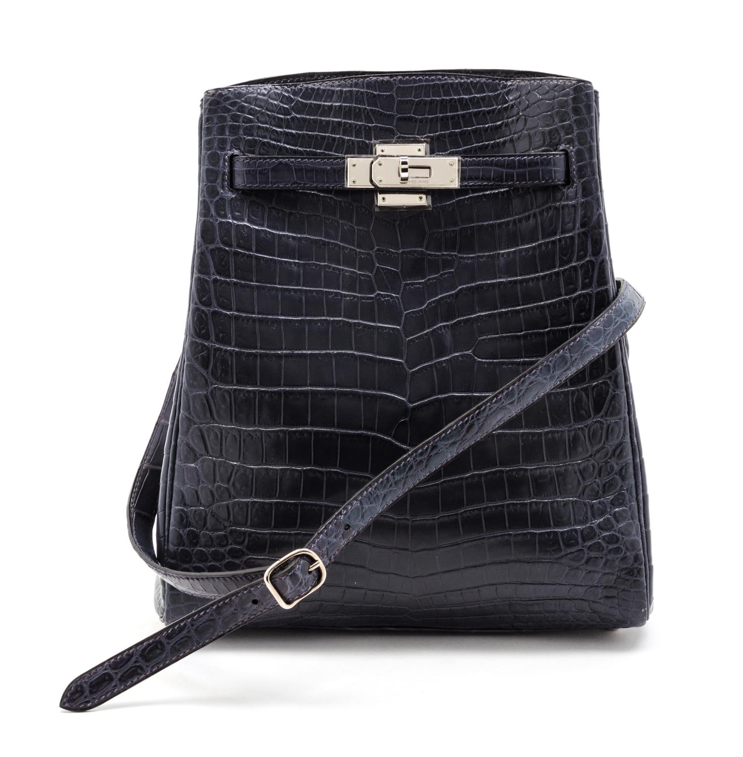An Hermes 25cm Navy Niloticus Crocodile Kelly Sport Bag, 11 x 9 1/2 x 4 1/2 inches.