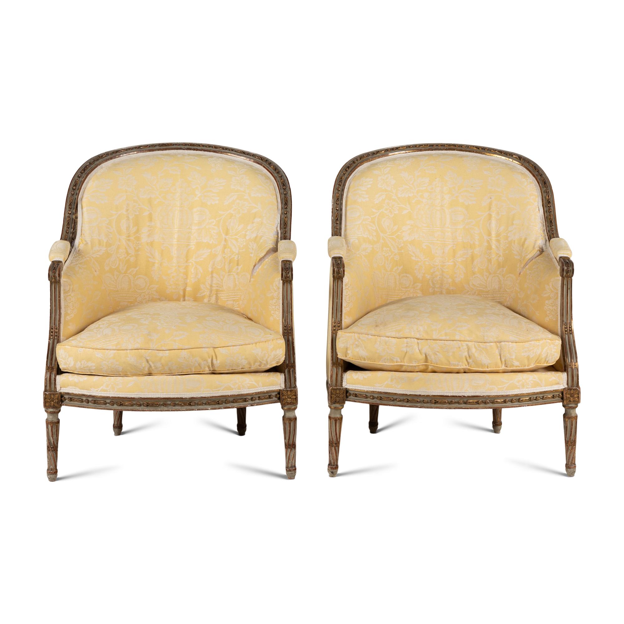 A Pair of Louis XVI Painted and Parcel Gilt Bergères