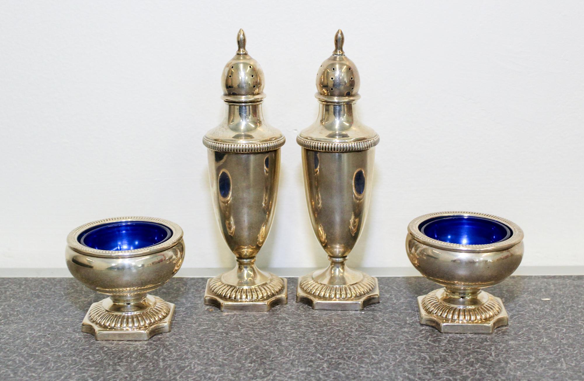 A Group of Four American Silver Table Articles, Fisher Silversmiths Inc., Jersey City, NJ, comprising a pair of casters and a pair of s