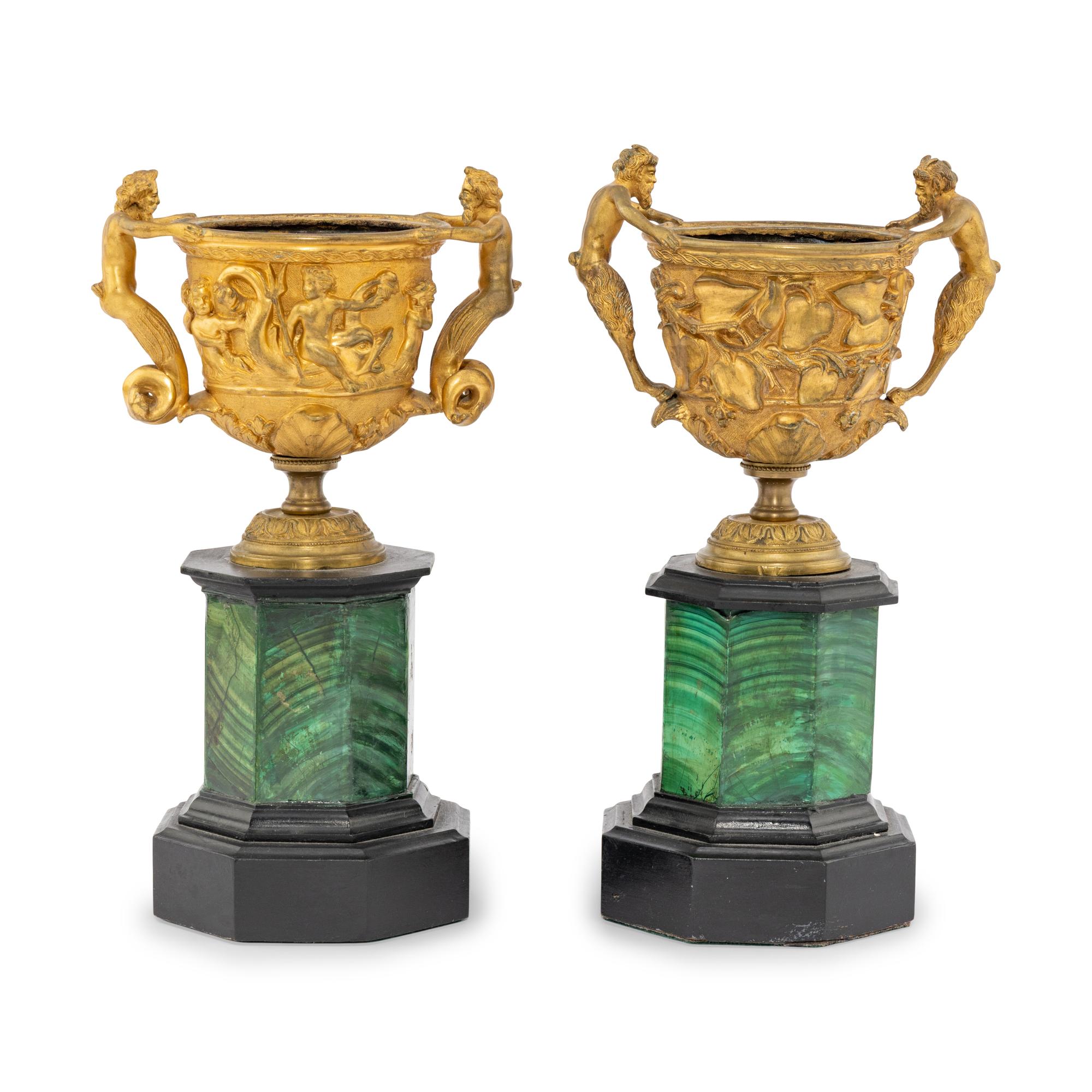 A Near Pair of Gilt-Bronze Urns on Malachite Stands