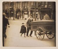 Man and Young Boy with Wagon