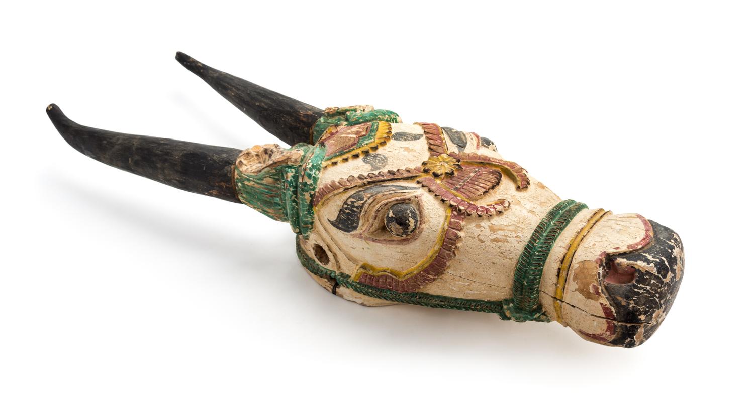 An Indonesian Polychrome Decorated Carved Wood Ceremonial Steer Head Height 37 x width 7 3/4 x depth 6 1/2 inches. — 20TH CENTURY