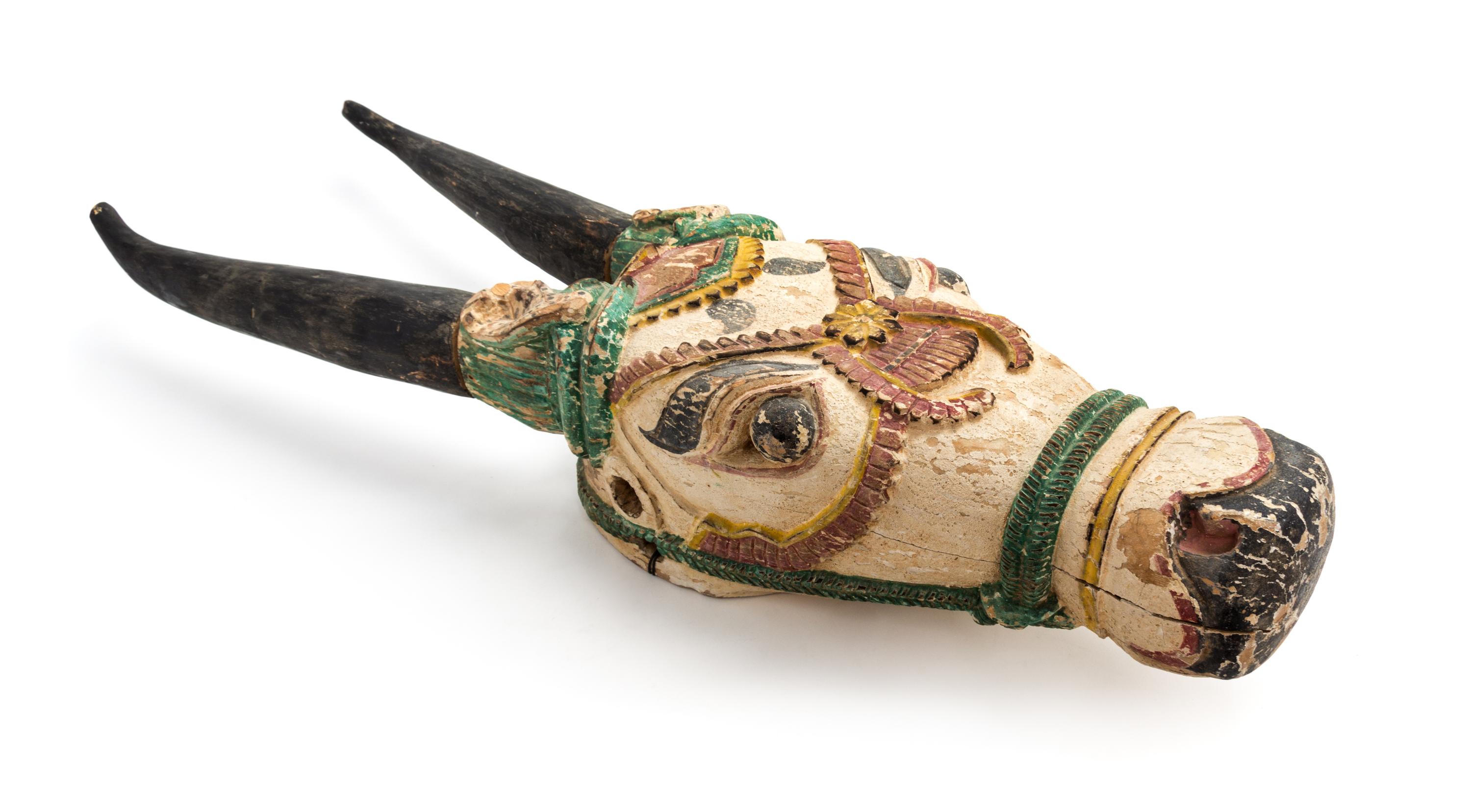 An Indonesian Polychrome Decorated Carved Wood Ceremonial Steer Head Height 37 x width 7 3/4 x depth 6 1/2 inches. — 20TH CENTURY