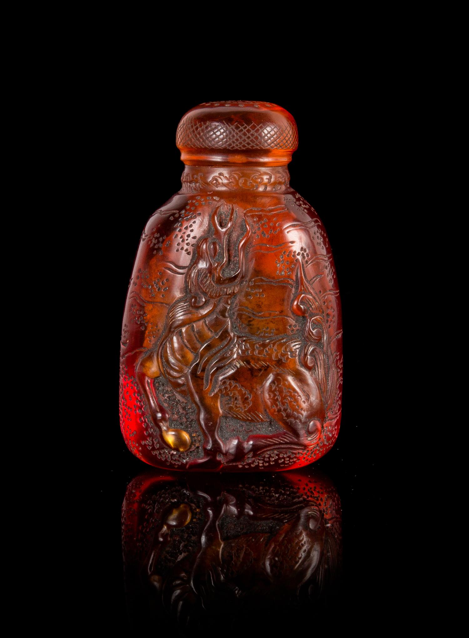 A Chinese Amber Snuff Bottle Height 2 3/8 inches.