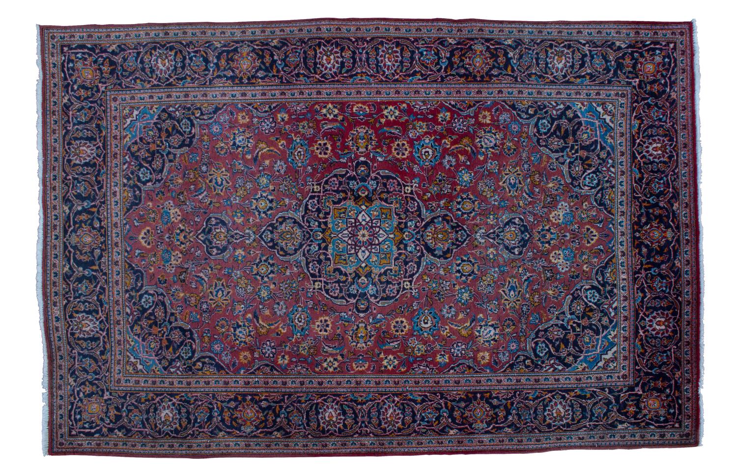 A Sarouk Wool Rug 9 feet 8 inches x 6 feet 7 inches.