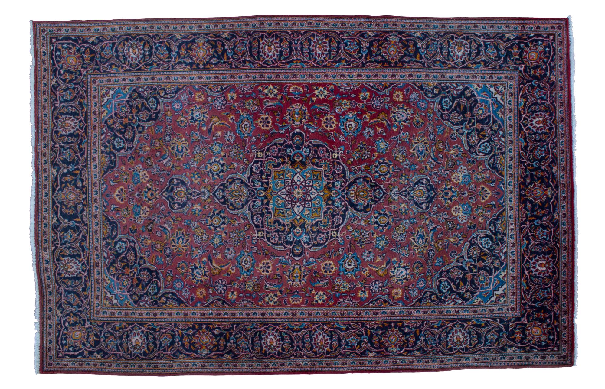 A Sarouk Wool Rug 9 feet 8 inches x 6 feet 7 inches.