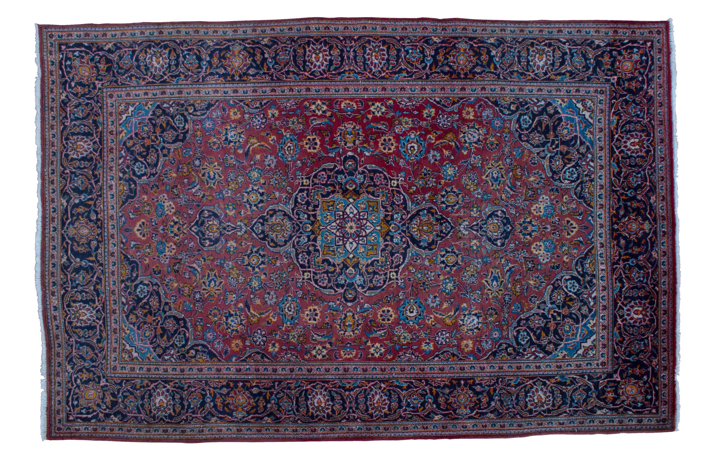 A Sarouk Wool Rug 9 feet 8 inches x 6 feet 7 inches.