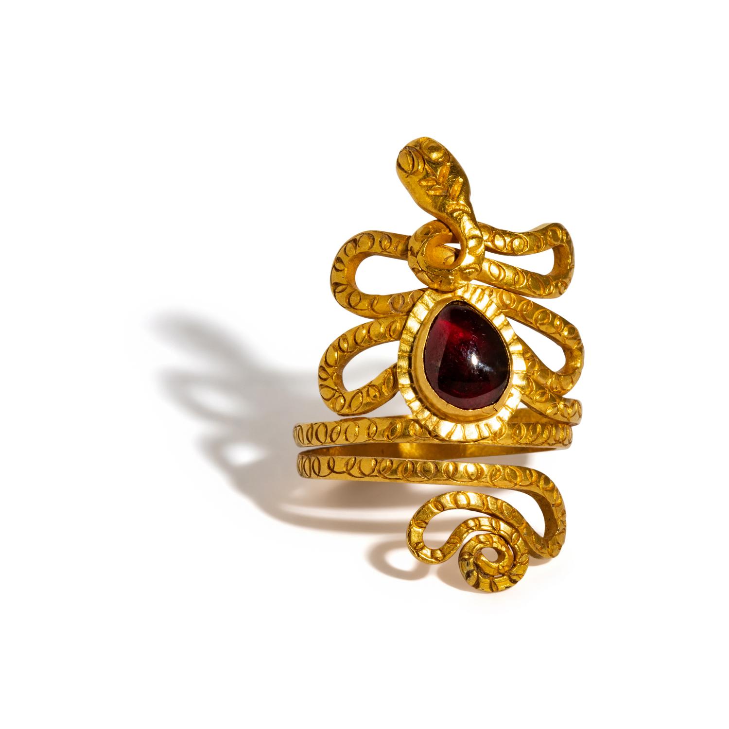 An Egyptian Gold and Garnet Snake Ring