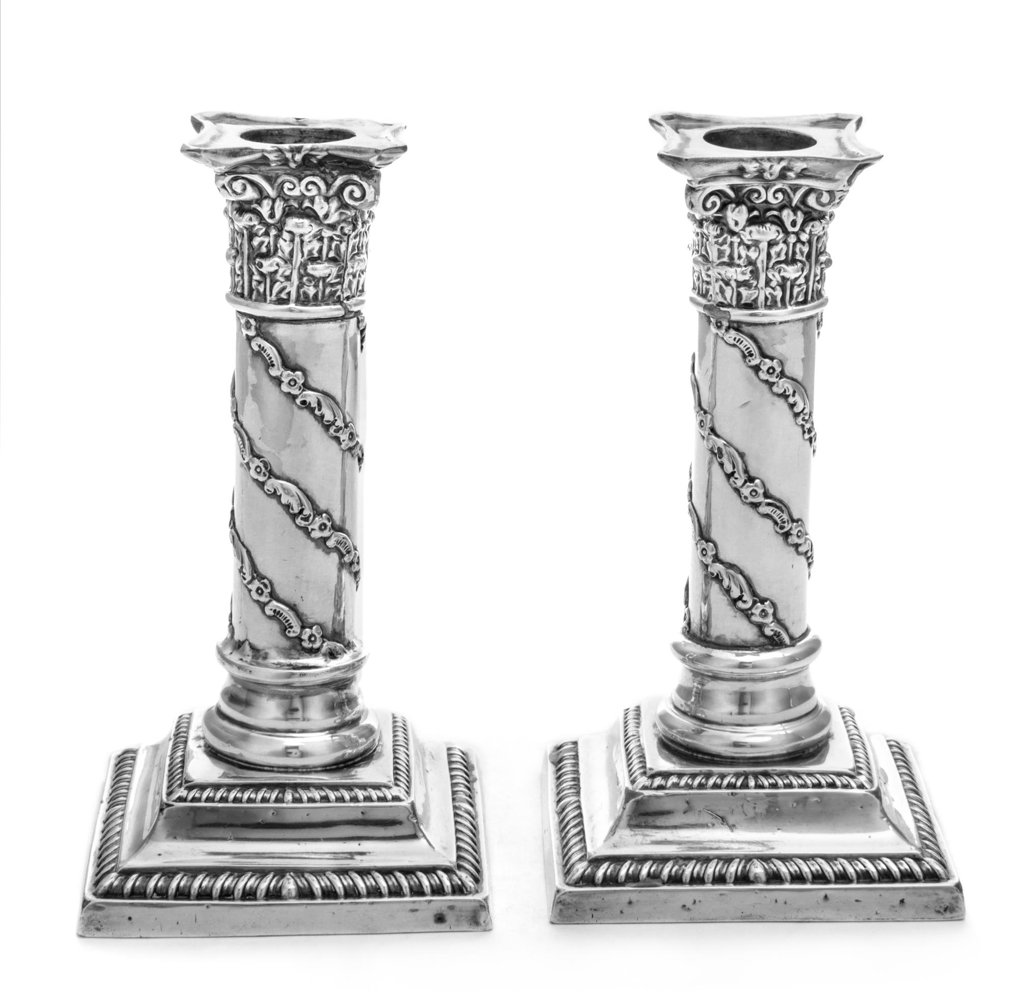 A Pair of Victorian Silver Candlesticks, Maker's Mark Obscured, Birmingham, 1897, weighted, cast as columns with flowering vine decorat