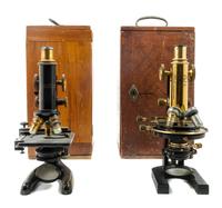 Two Brass and Black Lacquered Microscopes Height of taller 12 1/4 inches. — CARL ZEISS, AND BAUSCH AND LOMB, LATE 19TH/EARLY 20TH CENTURY
