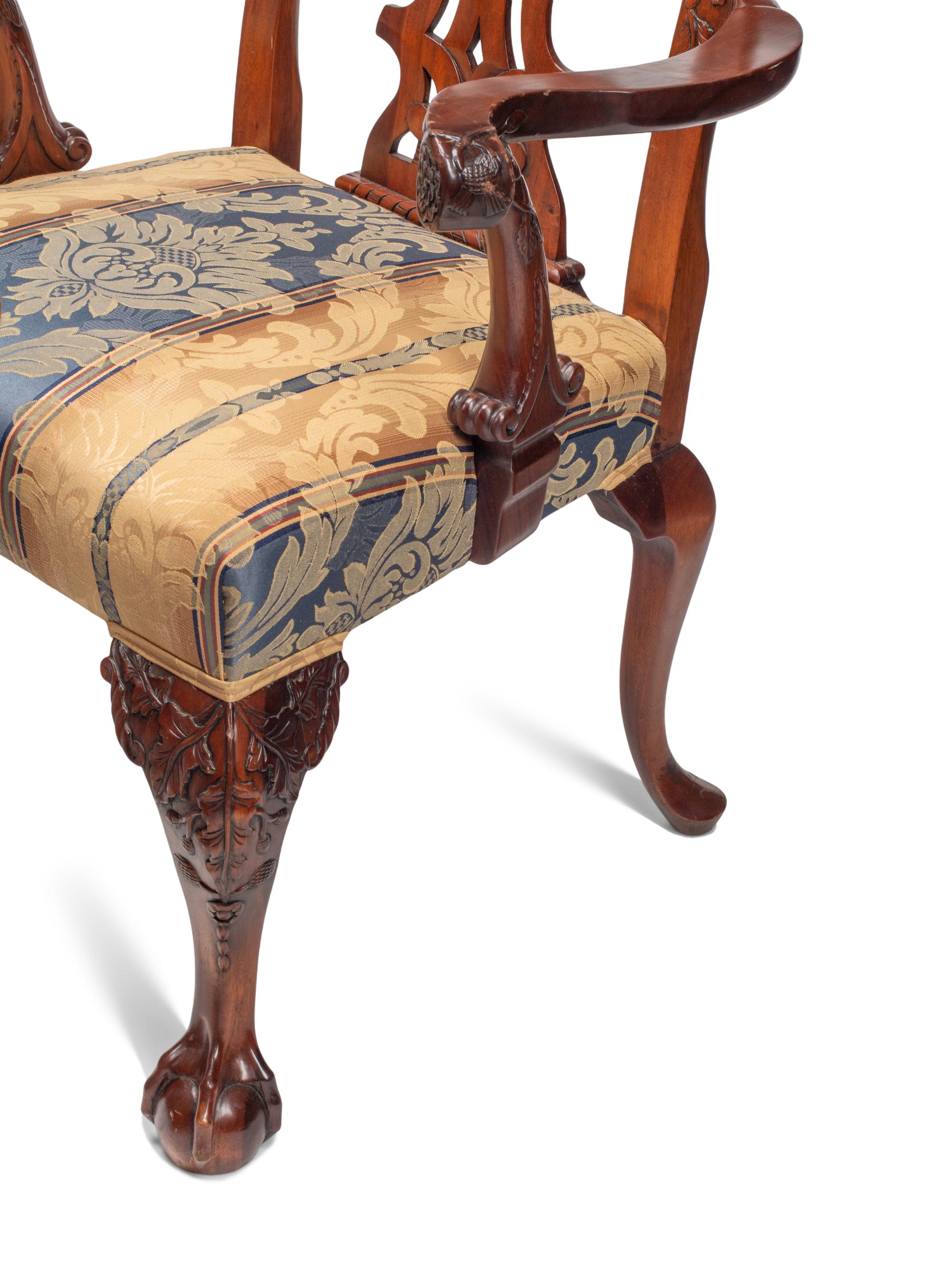 A Set of Eight George III Style Carved Mahogany Dining Chairs