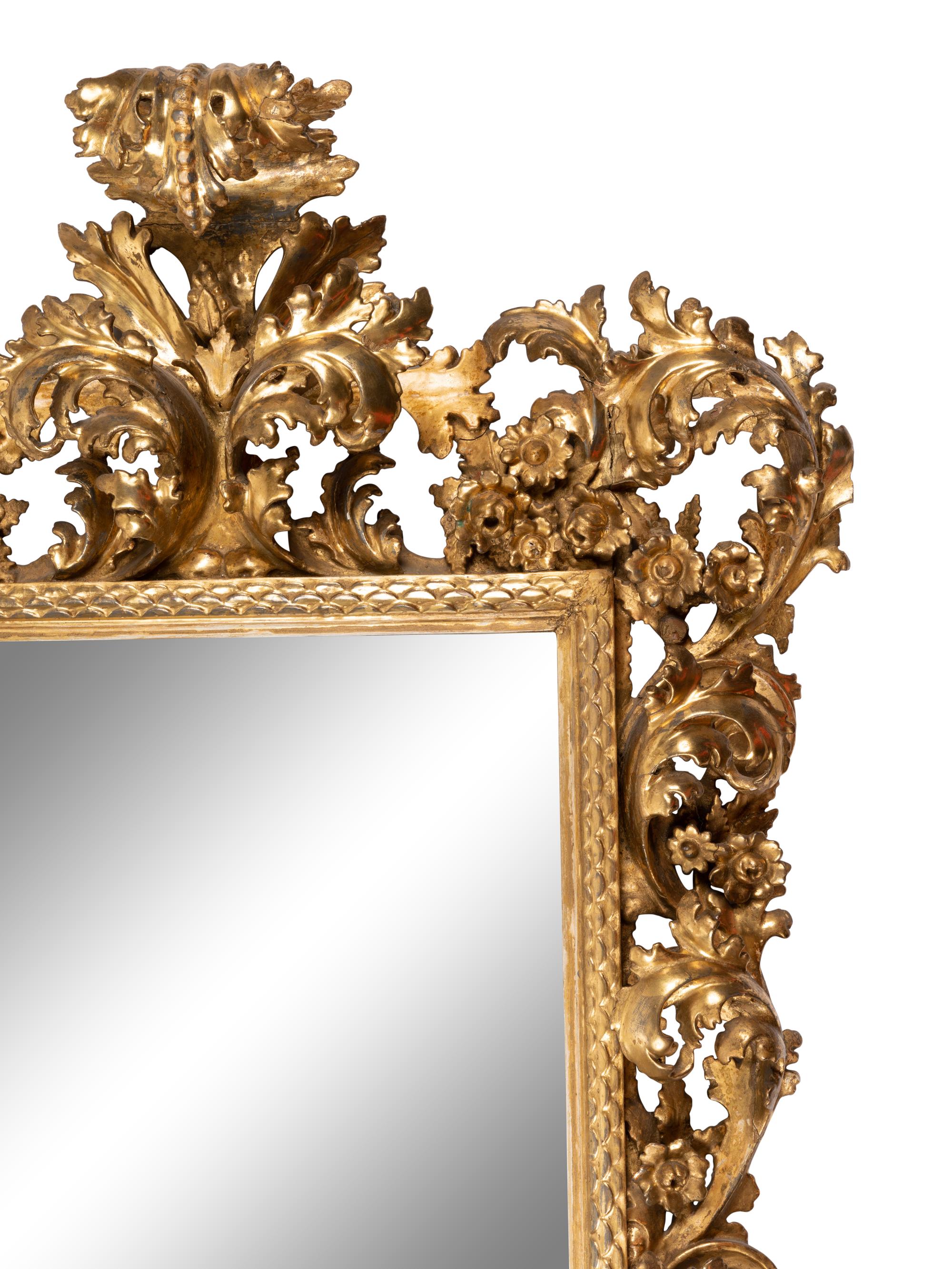 An Italian Baroque Style Giltwood Mirror