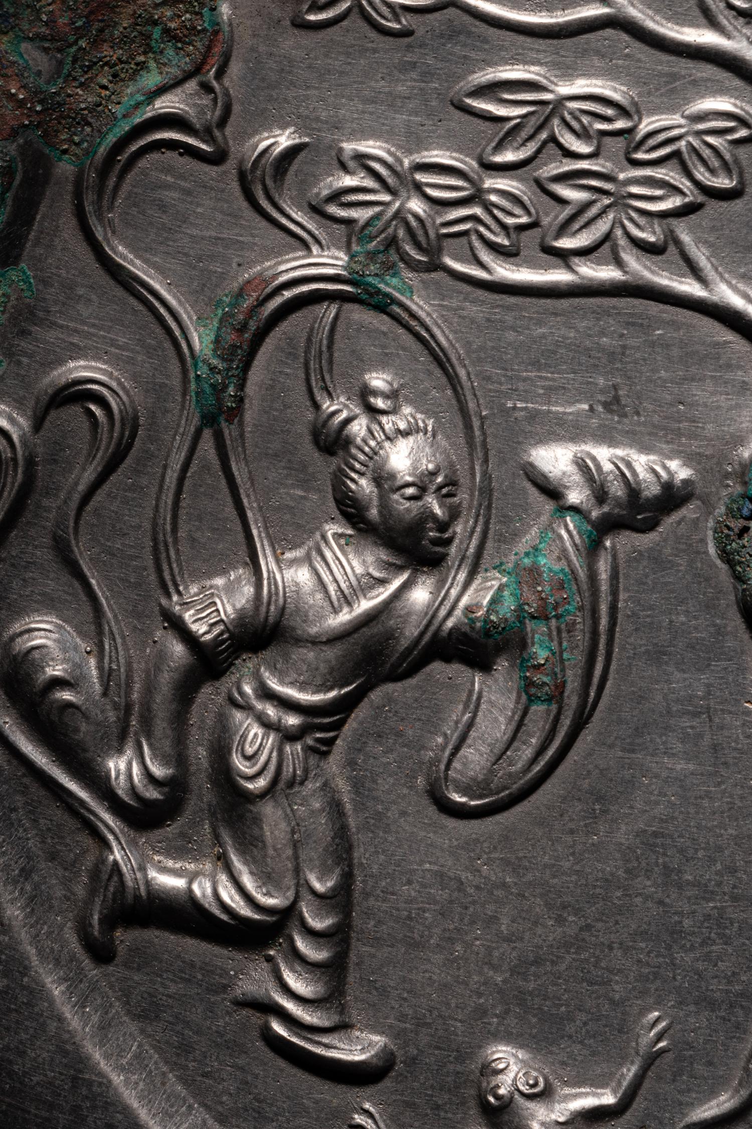 A Bronze 'Moon Palace' Mirror