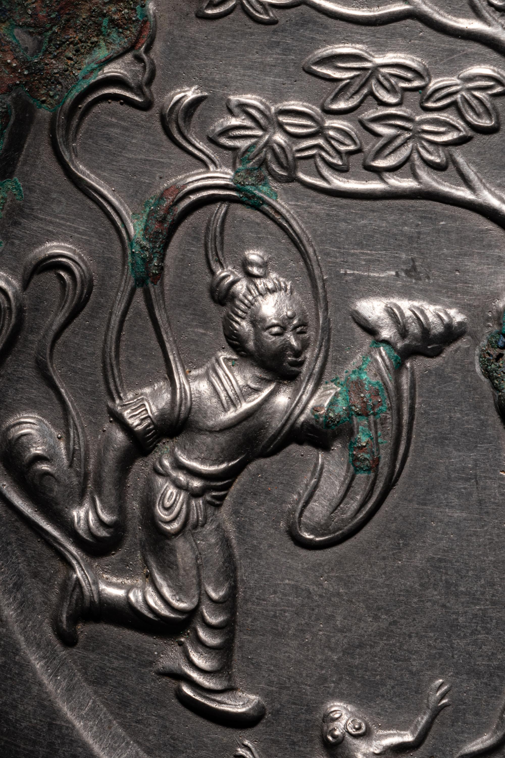 A Bronze 'Moon Palace' Mirror