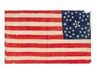 [FLAGS]. 38-star American parade flag with floral star pattern. Ca 1876-1889.