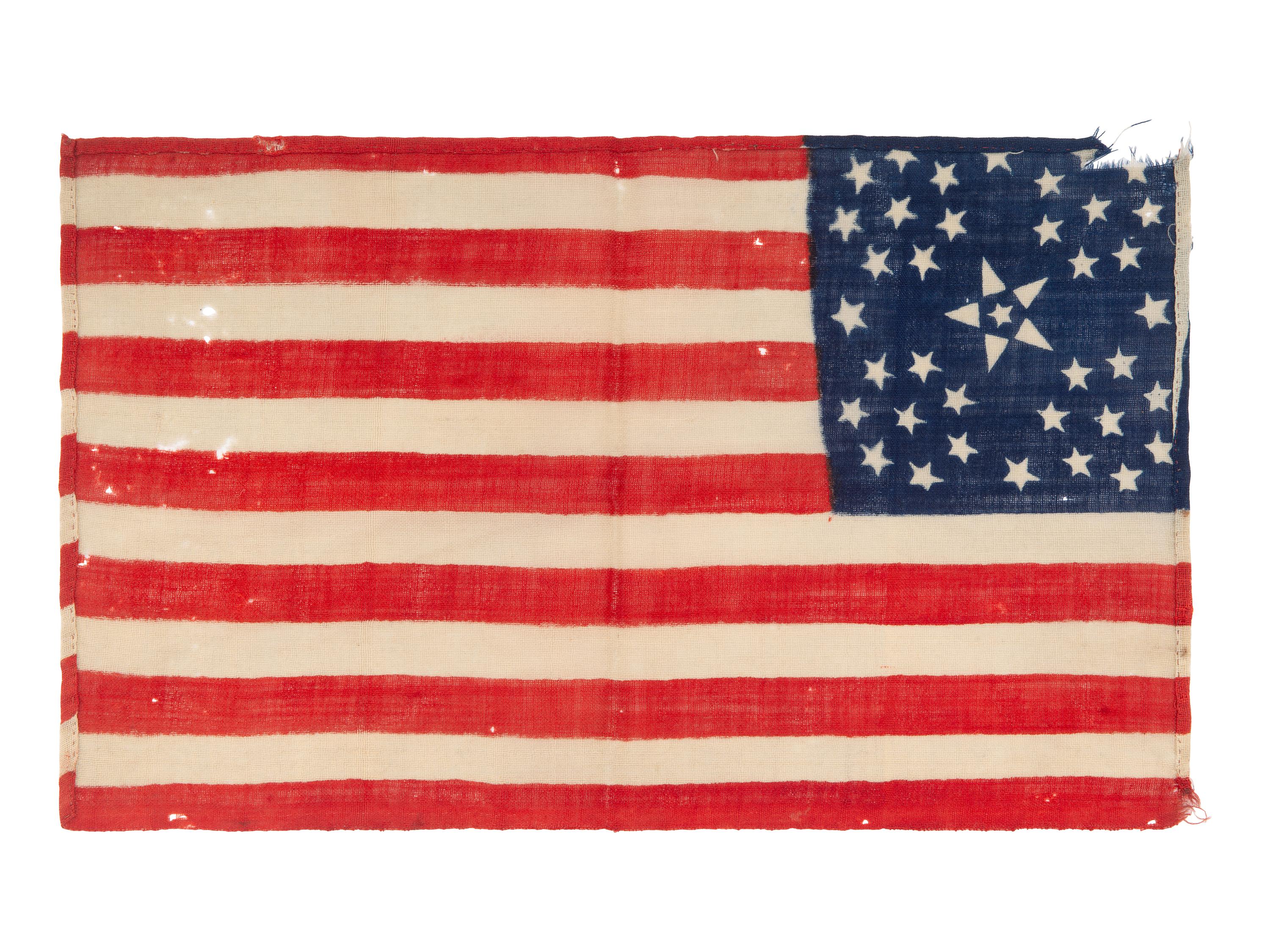 [FLAGS]. 38-star American parade flag with floral star pattern. Ca 1876-1889.