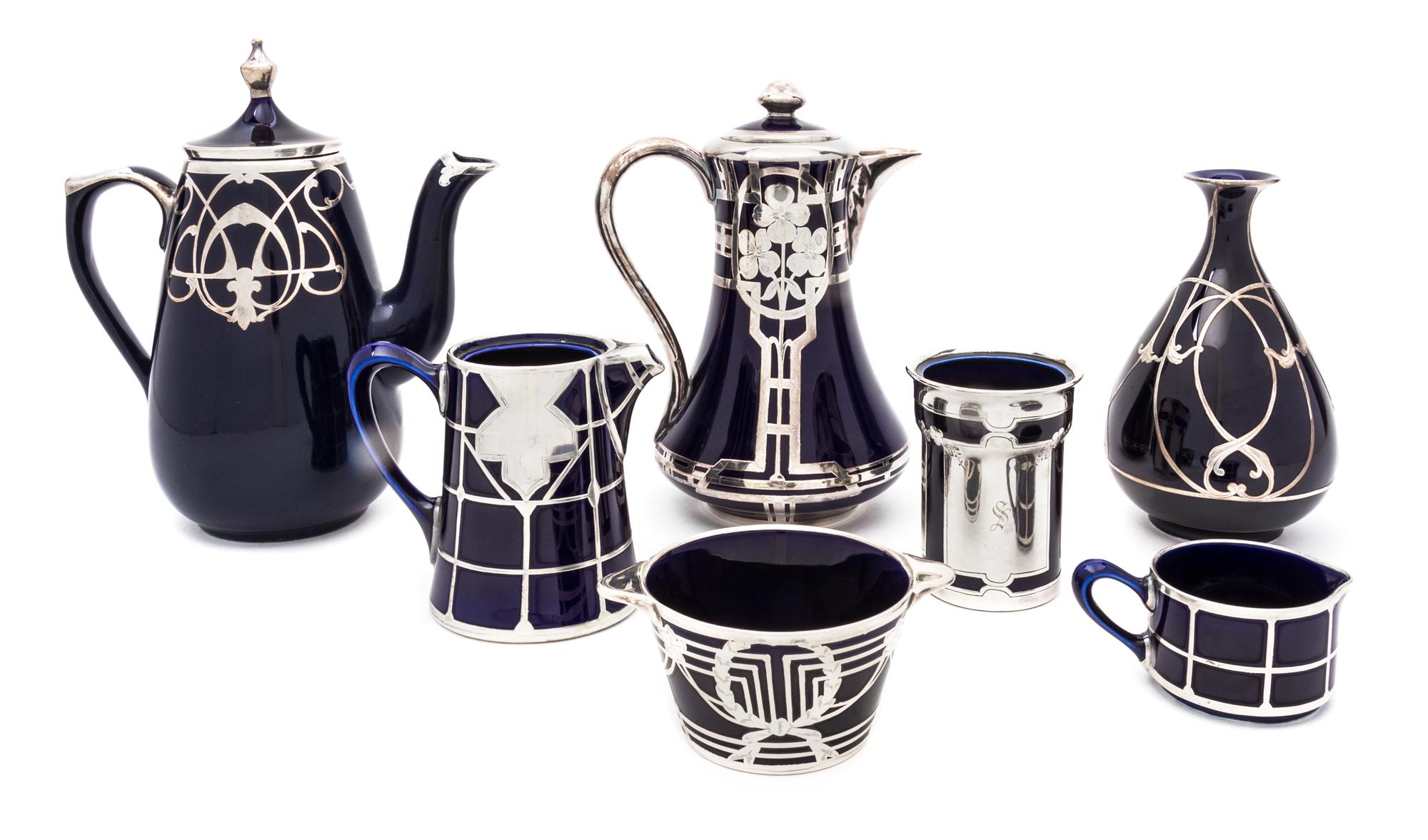 A Group of Seven Silver Overlay Porcelain Table Articles Height of first 8 3/4 inches.