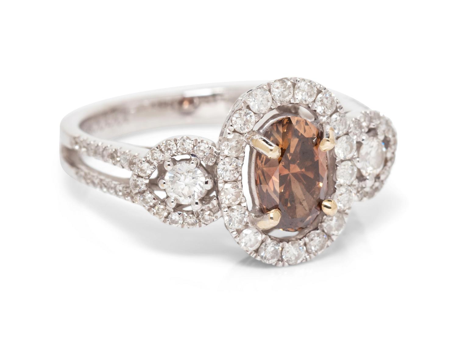 An 18 Karat White Gold, Colored Diamond and Diamond Ring,