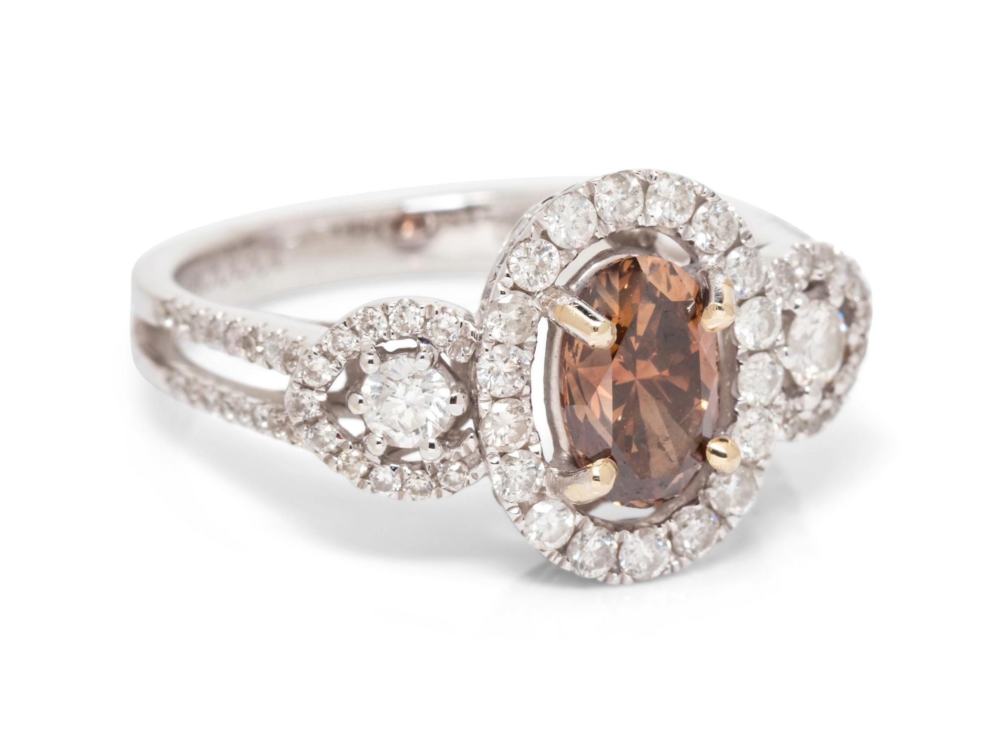 An 18 Karat White Gold, Colored Diamond and Diamond Ring,