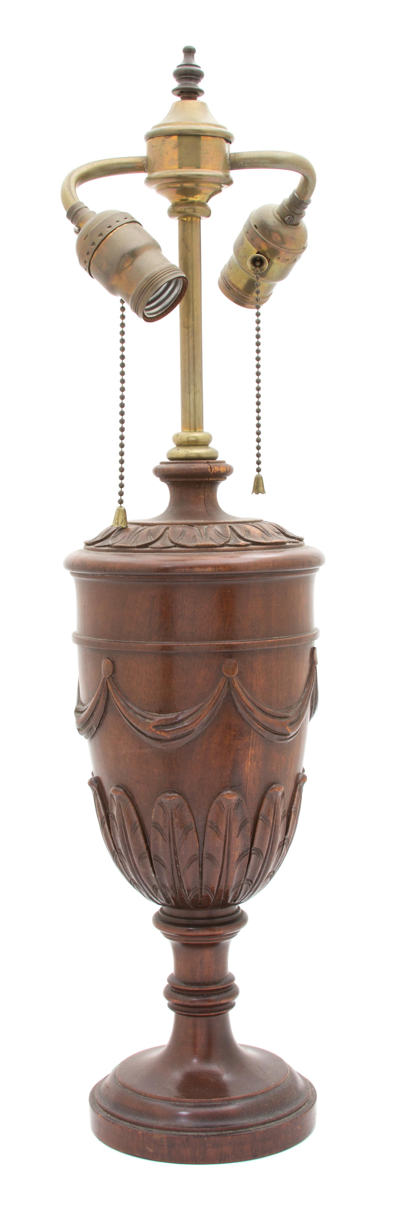 A Regency Style Carved Mahogany Urn-Form Two-Light Table Lamp Height 23 inches.