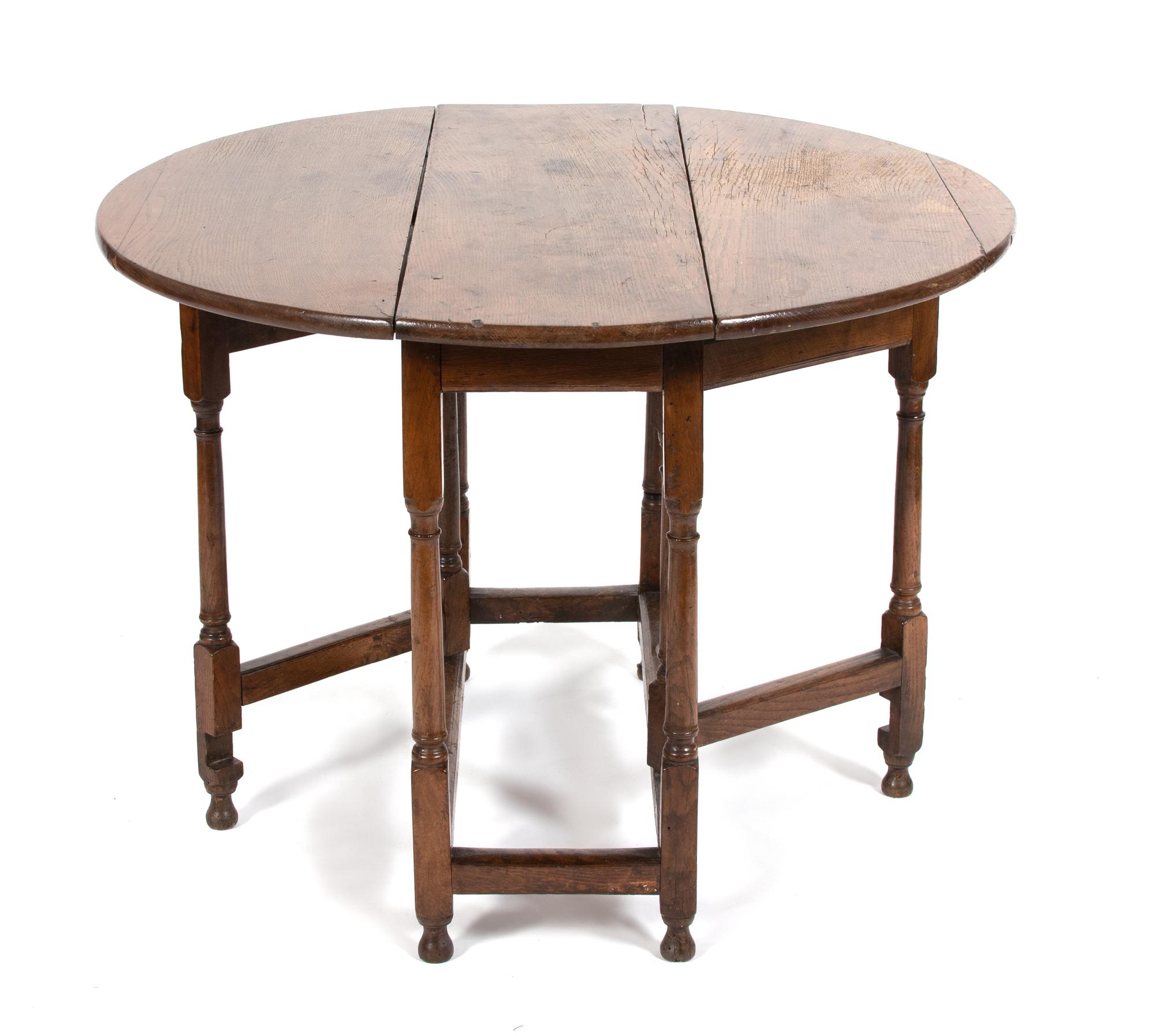 An English Jacobean Style Oak Gate Leg Table Height 27 x width 38 x depth 12 1/2 inches (closed). — 19TH CENTURY