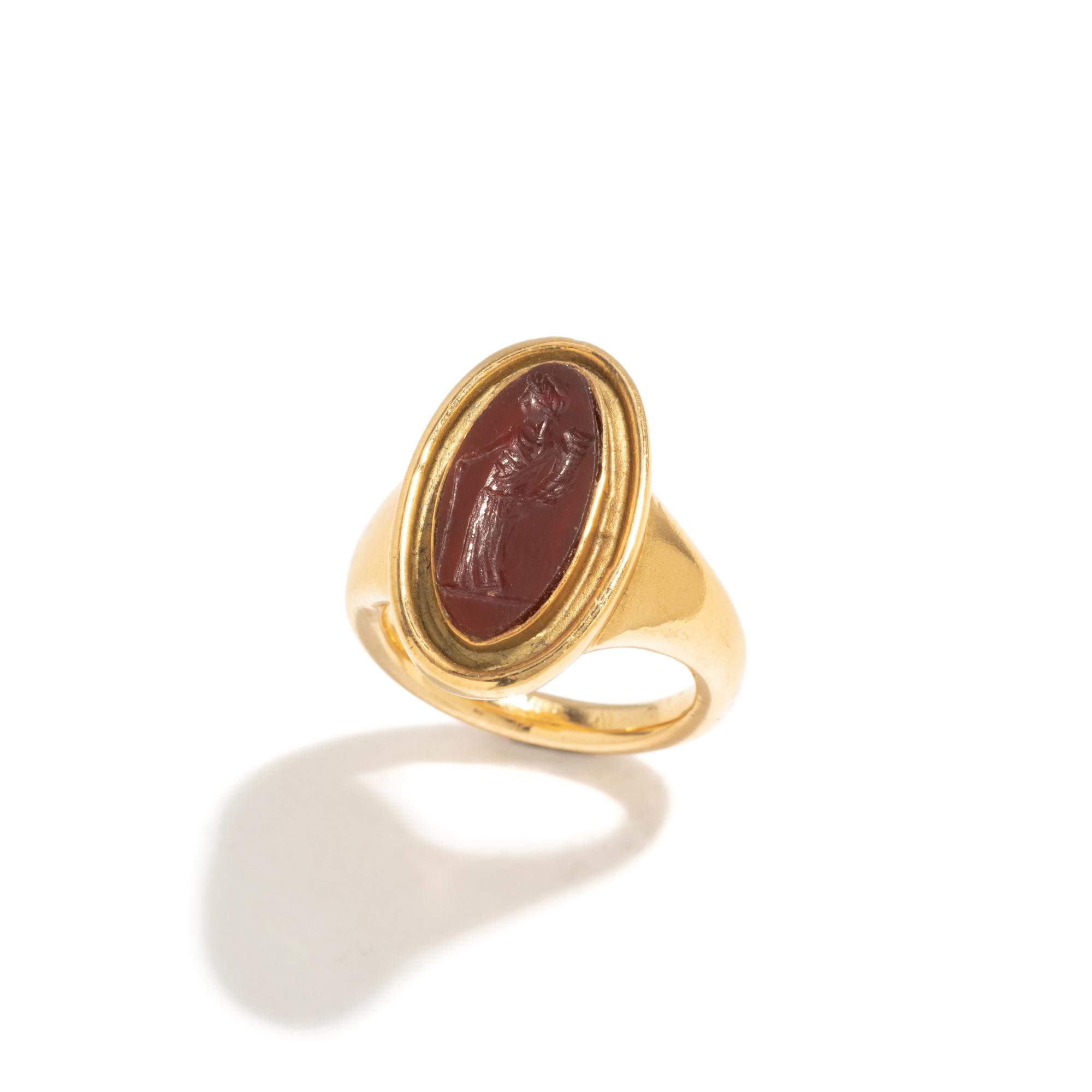 A Roman Carnelian Ring Stone with the Goddess Ceres — Set in a gold ring
