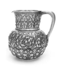 An American Silver Water Pitcher, Bigelow, Kennard & Co., Boston, MA, having a rounded body with a cylindrical neck, with floral and fo