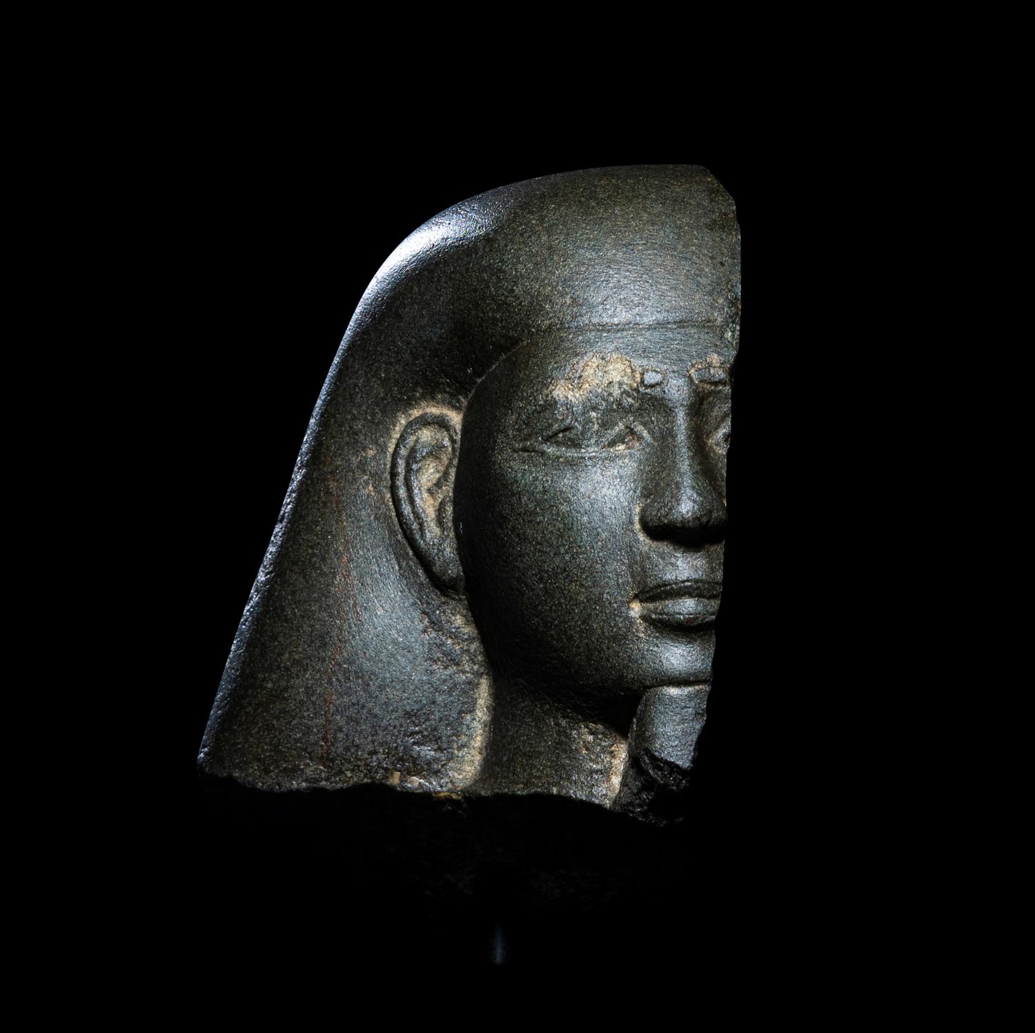 An Egyptian Schist Head of a Male