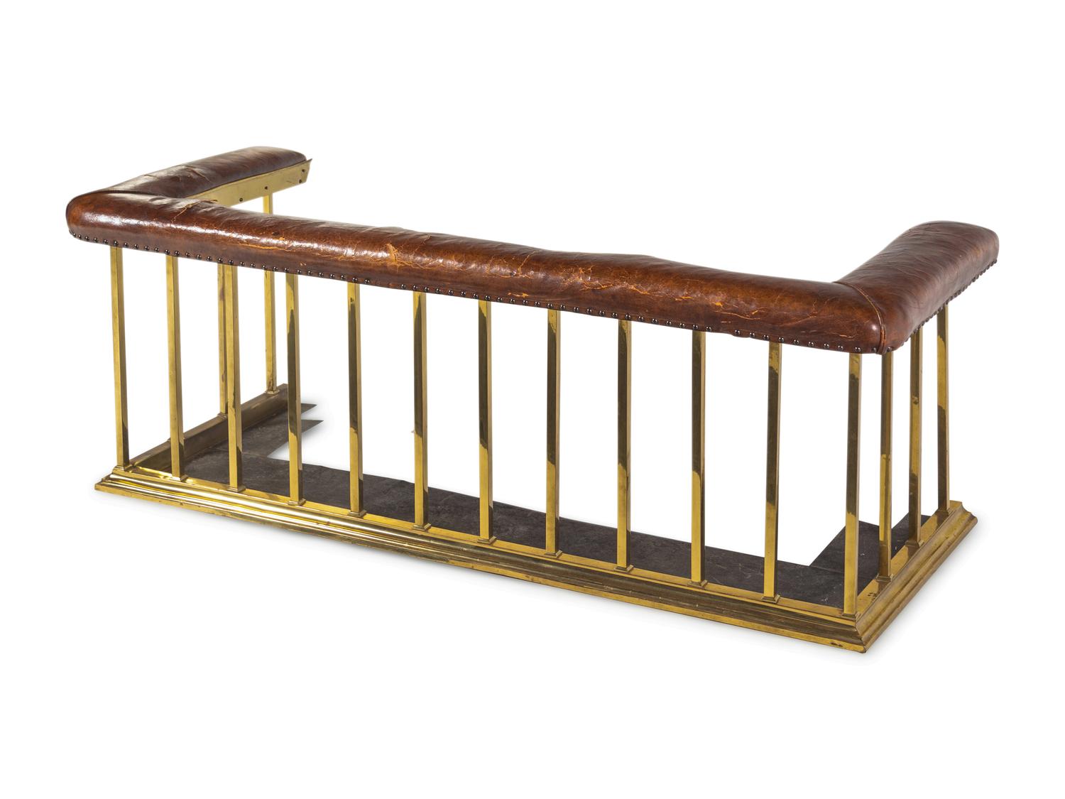 An English Leather-Upholstered Brass Club Fender