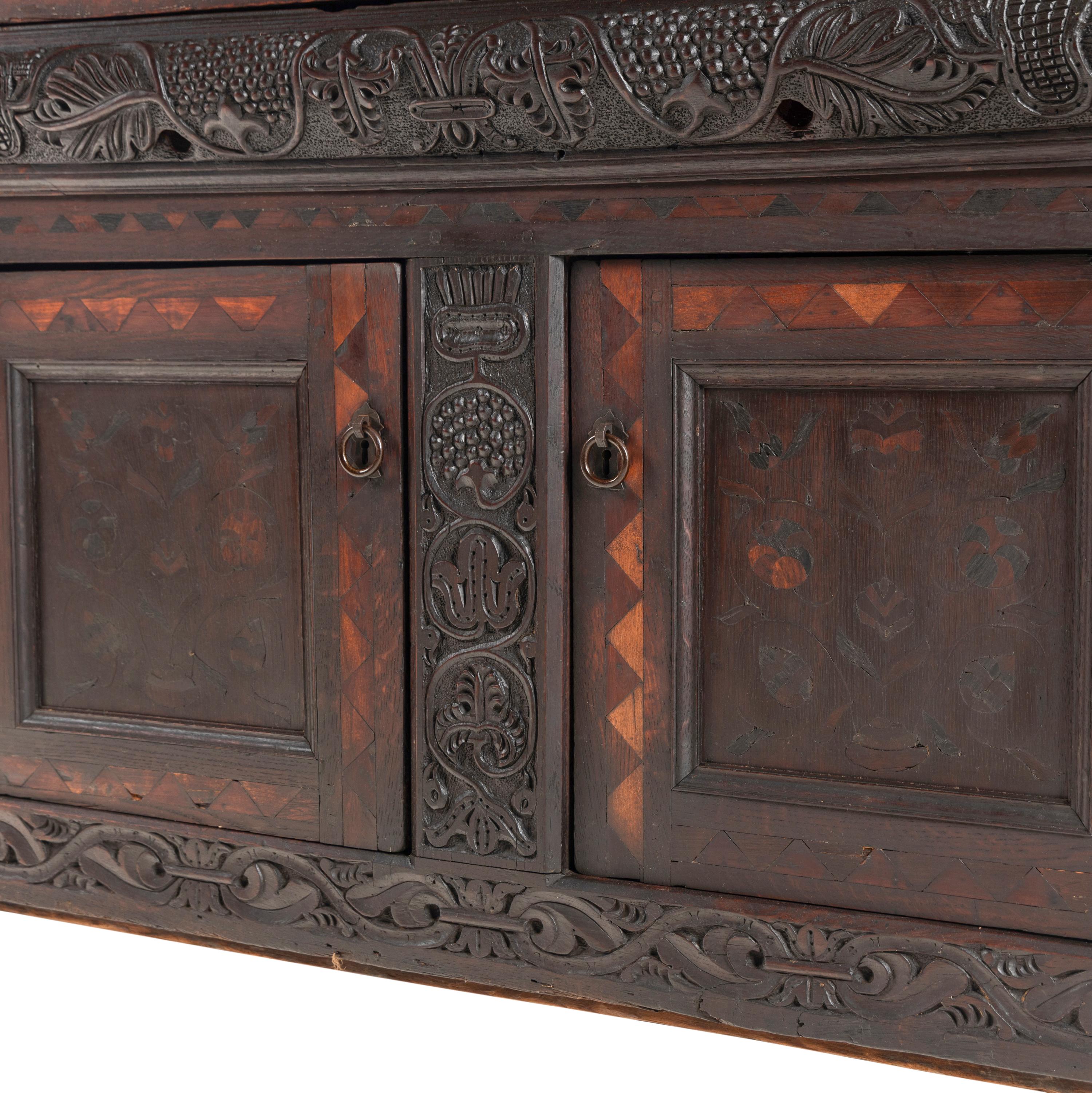 A William and Mary Carved Oak and Marquetry Court Cupboard