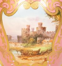 A Coalport Porcelain Pink-Glazed Urn