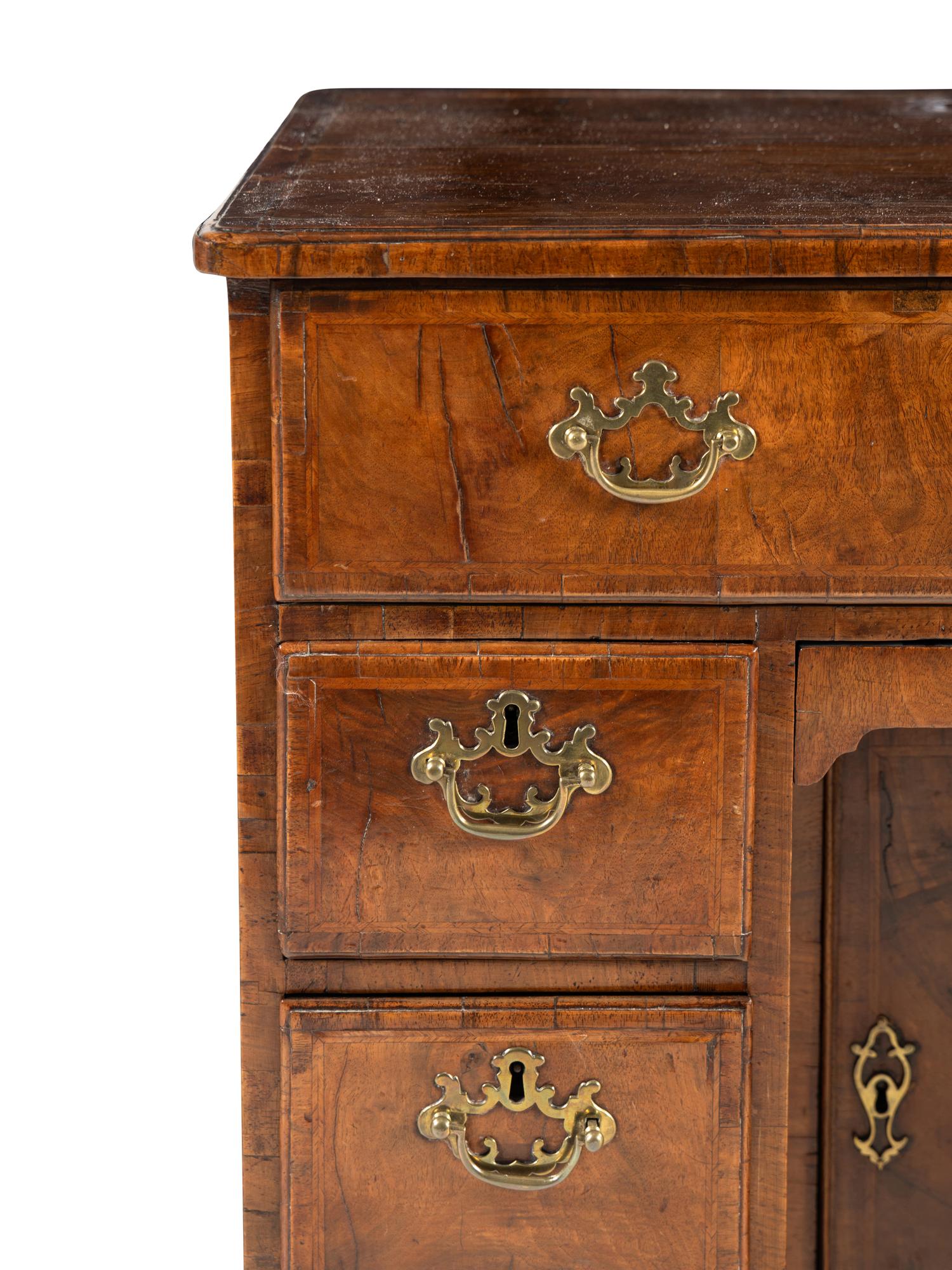 A George II Walnut Kneehole Desk