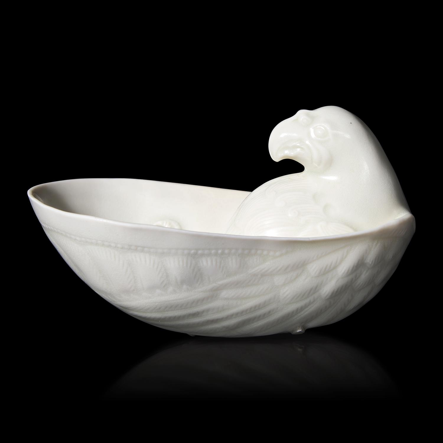 A Chinese Transparent Glazed 'Parrot' Cup, Song Dynasty 宋 白瓷鸚鵡杯