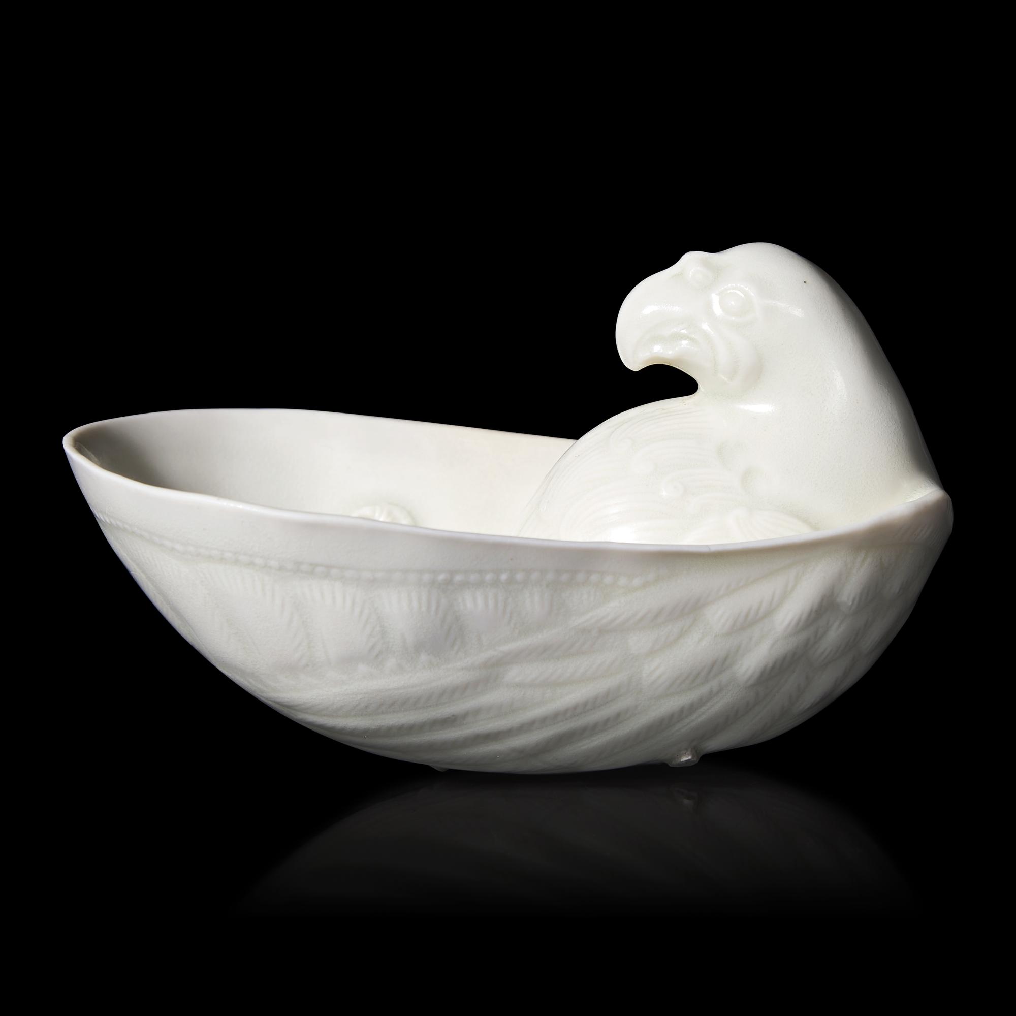 A Chinese Transparent Glazed 'Parrot' Cup, Song Dynasty 宋 白瓷鸚鵡杯