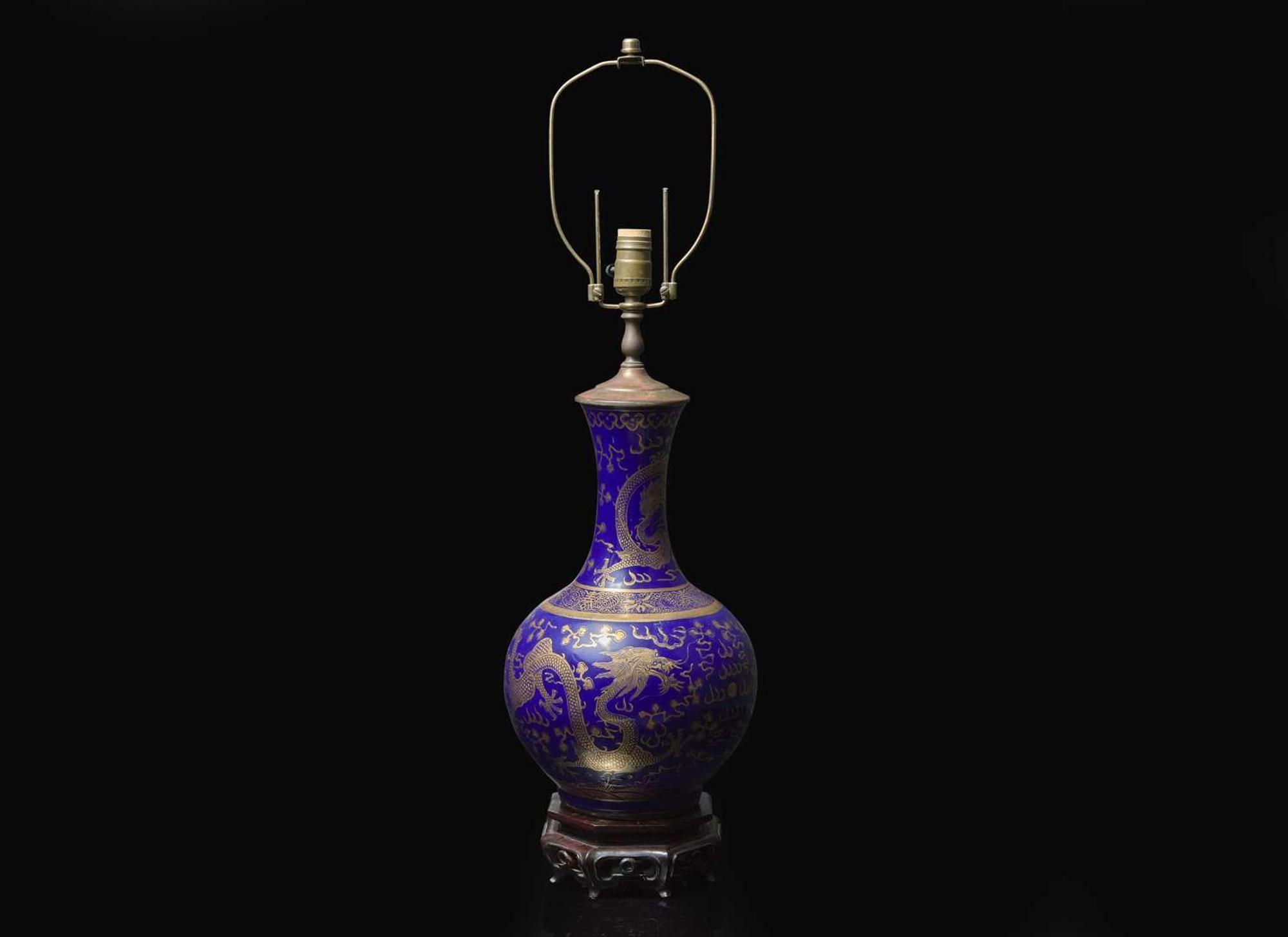 A Chinese gilt-decorated blue-glazed porcelain “Dragons” vase 藍地金彩雲龍紋賞瓶