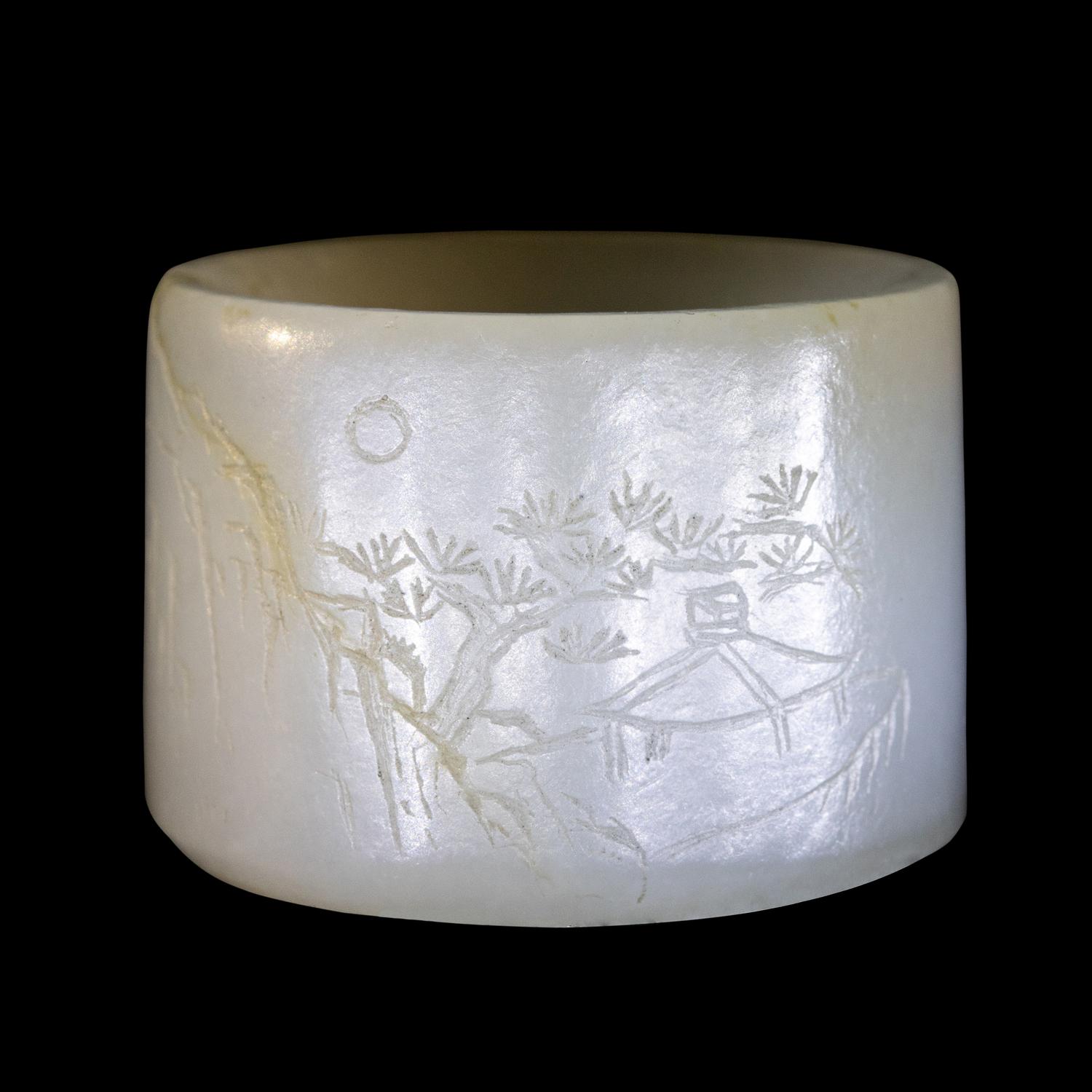 An Incised White Jade 'Landscape' Archer's Ring
