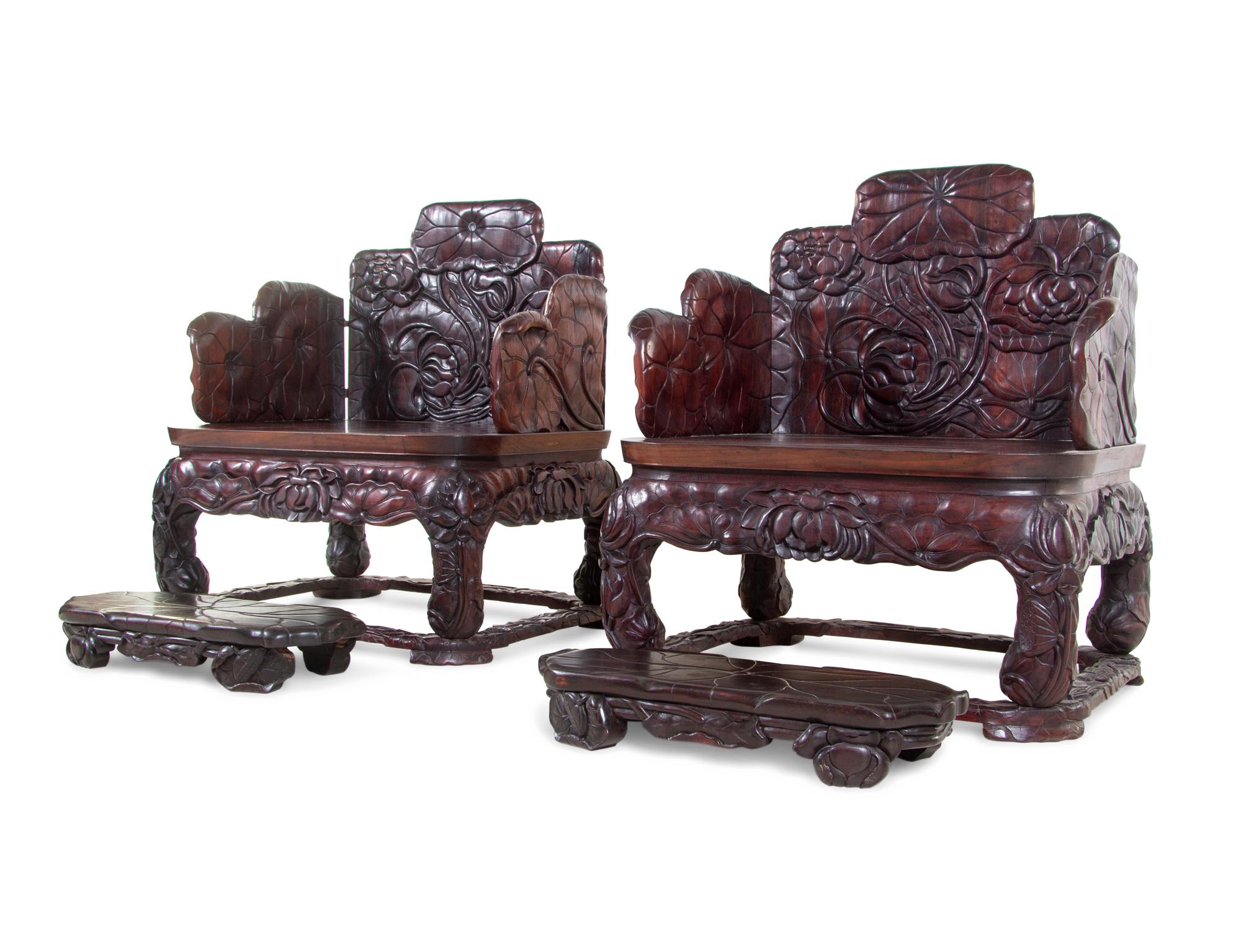 A Pair of Chinese Export Carved Hardwood Armchairs and Footrests