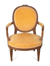 A Louis XVI Style Carved Fruitwood Fauteuil — EARLY 19TH CENTURY