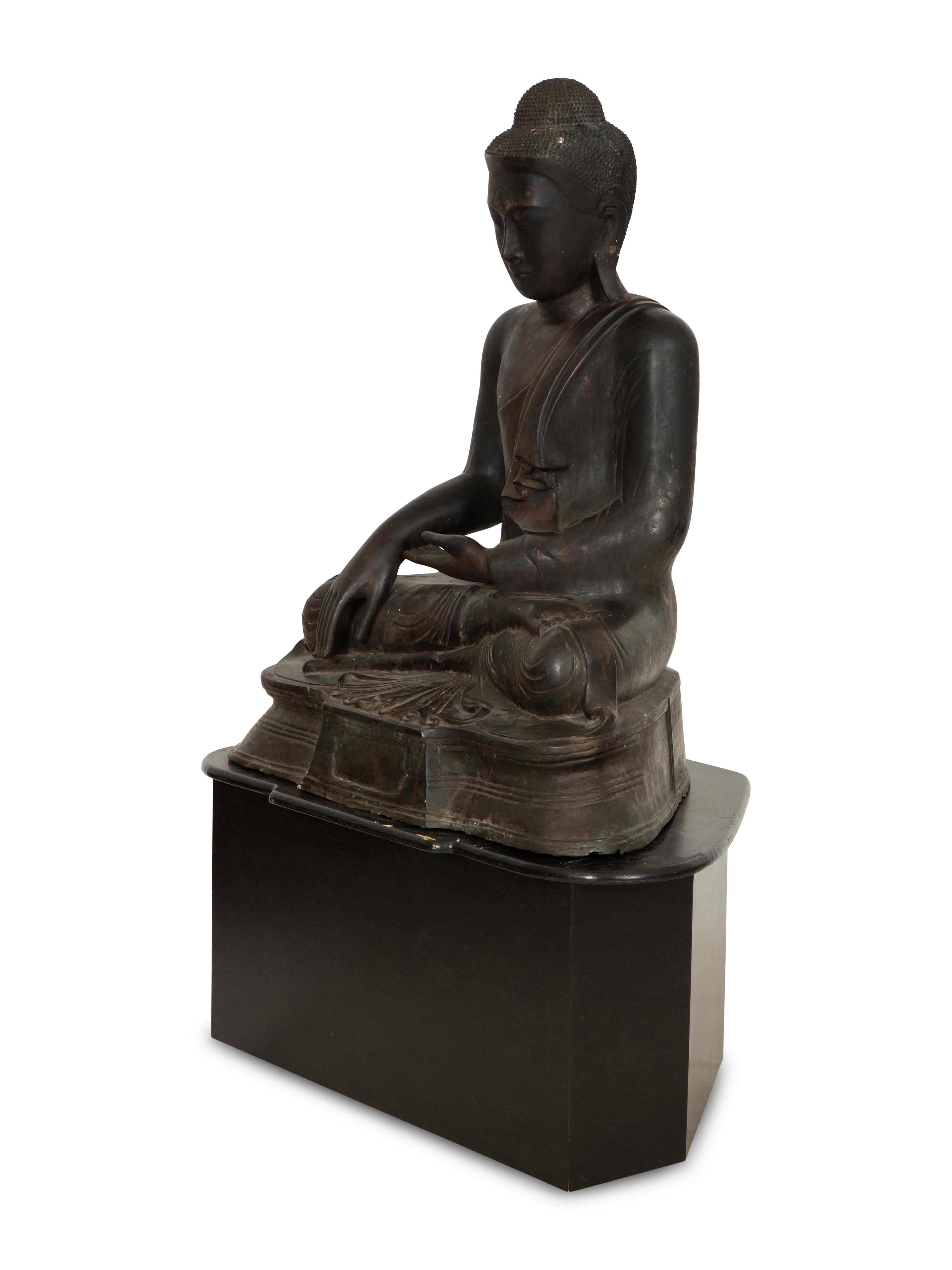 A Large Southeast Asian Bronzed Metal Seated Buddha