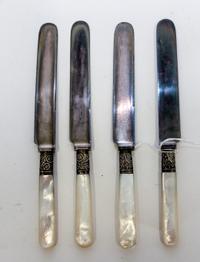A Set of Twelve Silver-Plate and Mother of Pearl Dinner Knives, , each with a mother of pearl handle, the ferrule decorated with floral