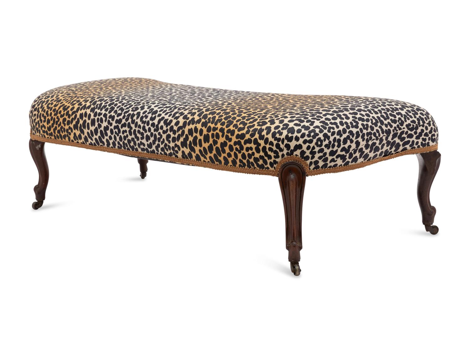 A Victorian Carved Mahogany Reniform Ottoman