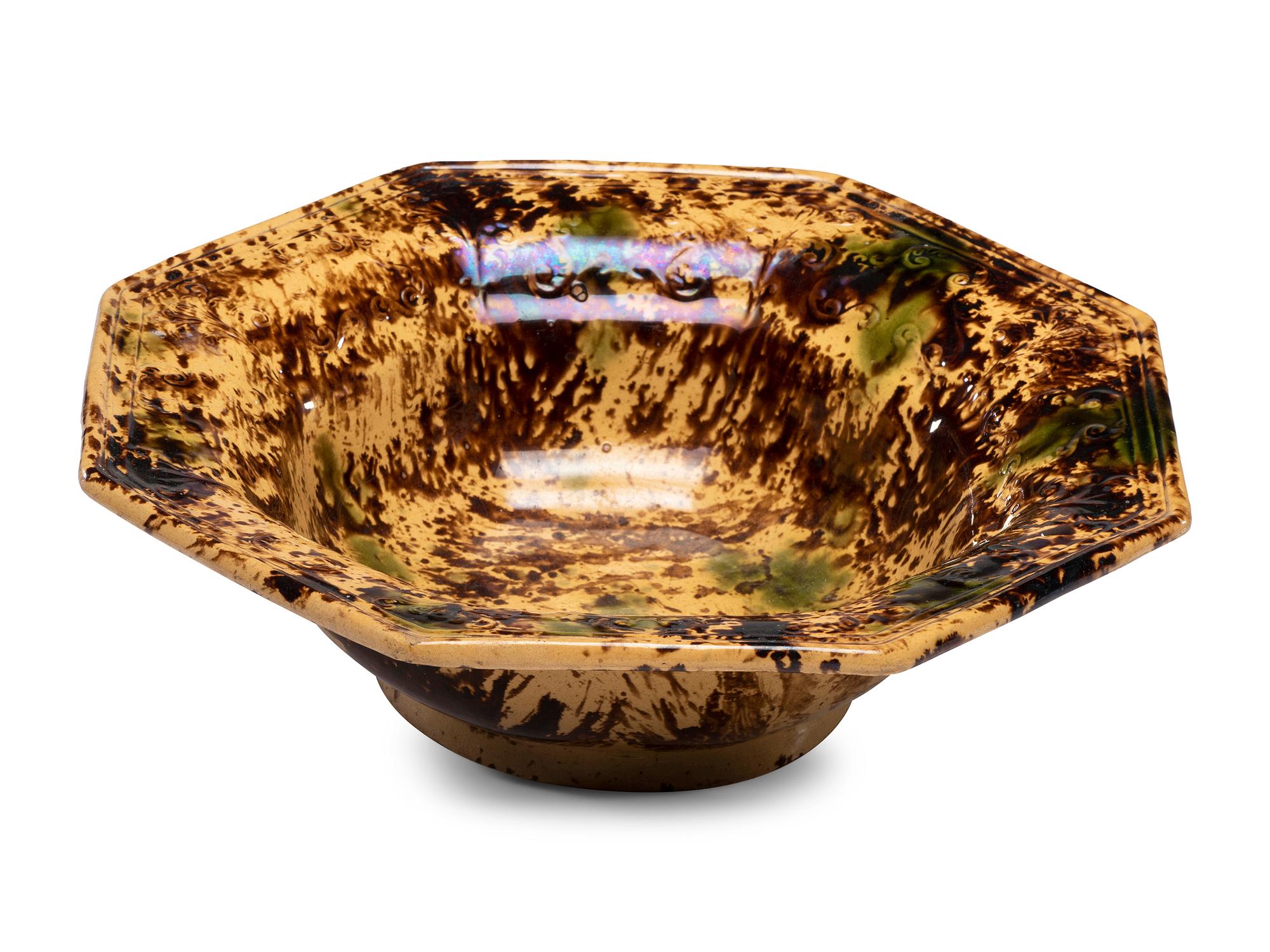 A Large Molded Yellowware Bowl with Flint Enamel Glaze